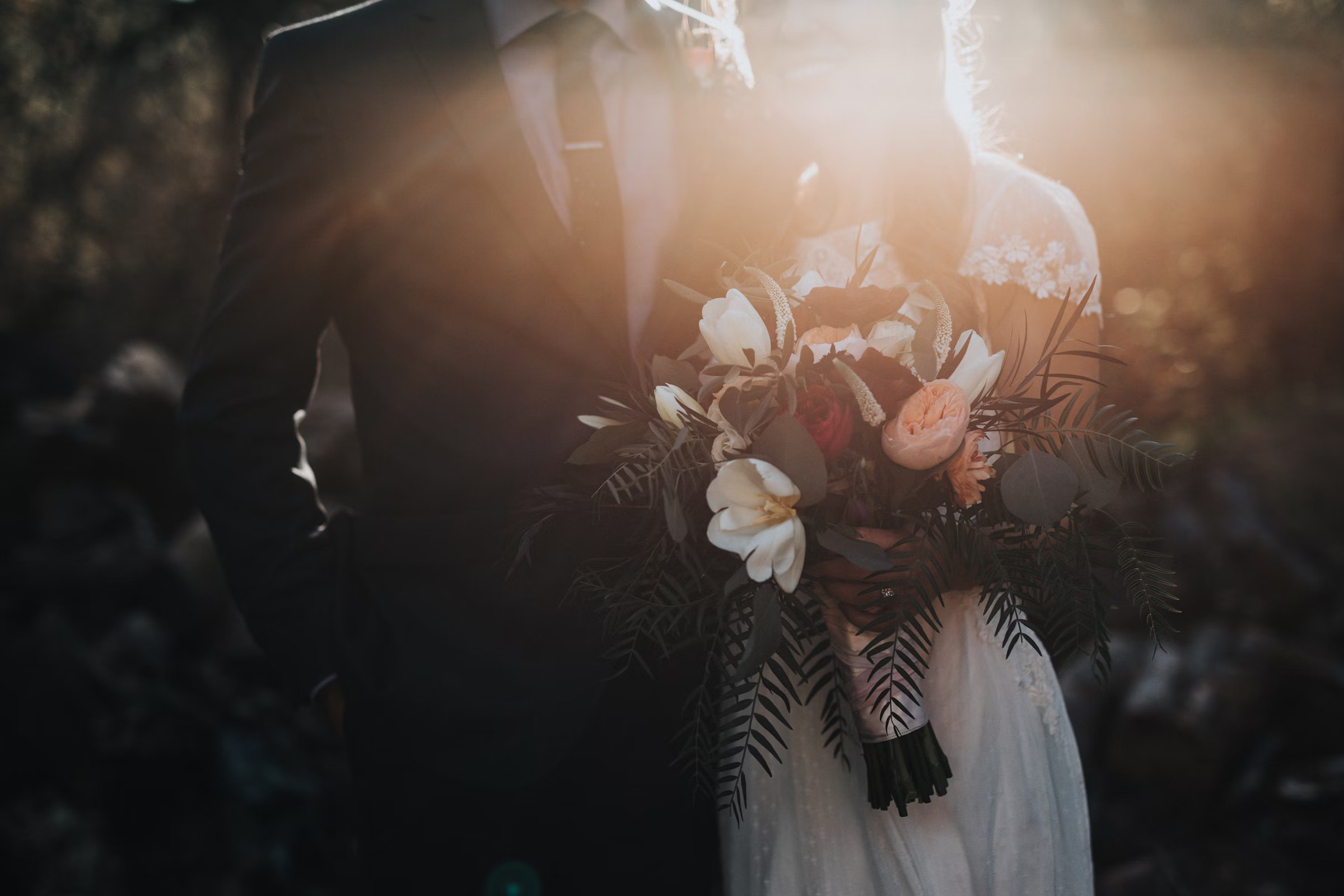 Elegant outdoor venue with floral arch and ocean view